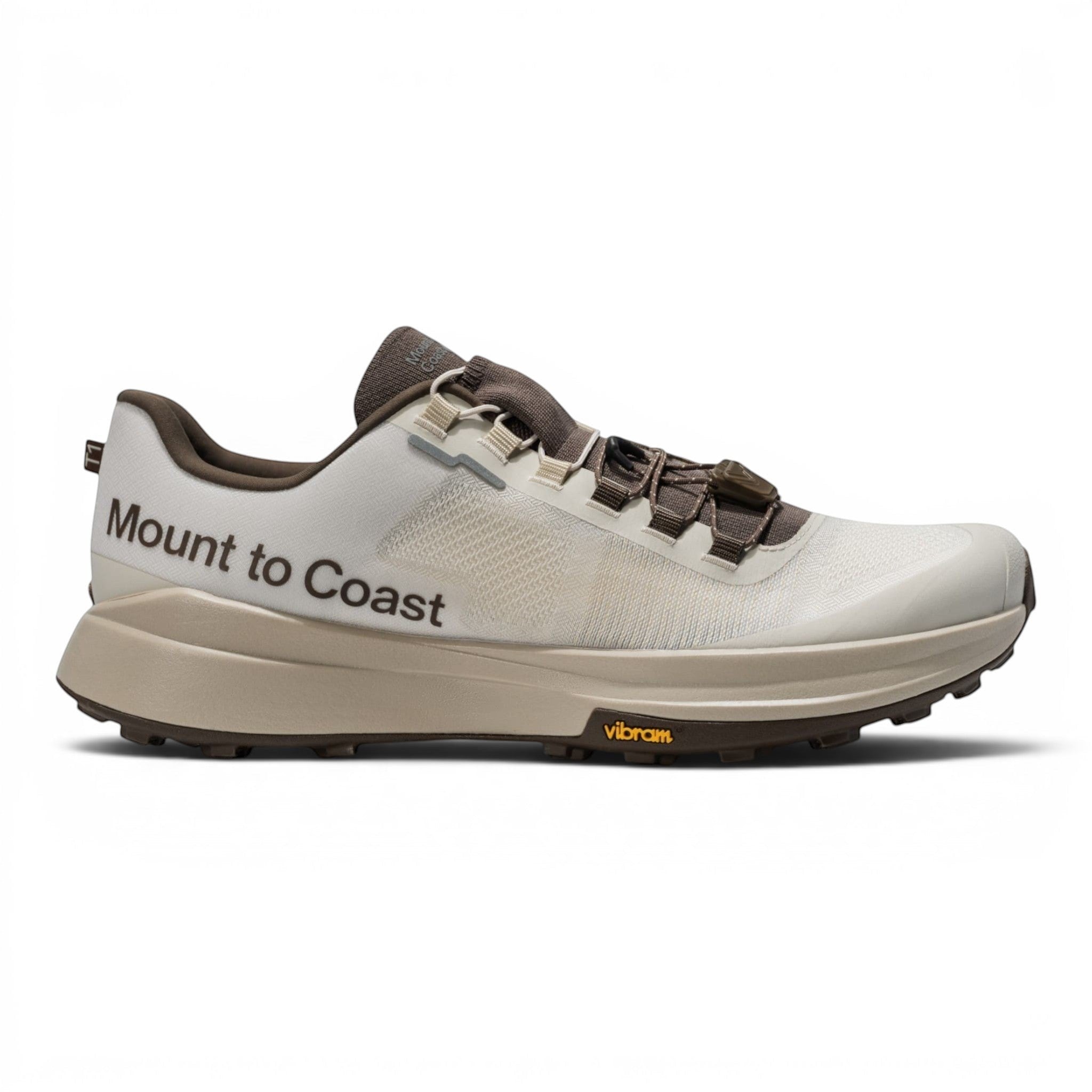 Endurance Edge T1 men's trail running shoes in beige with brown accents and Vibram outsole.