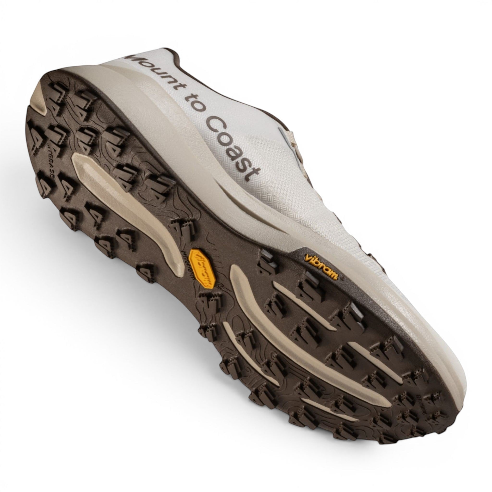 Endurance Edge T1 men's trail running shoes in light grey with a brown Vibram Megagrip outsole.