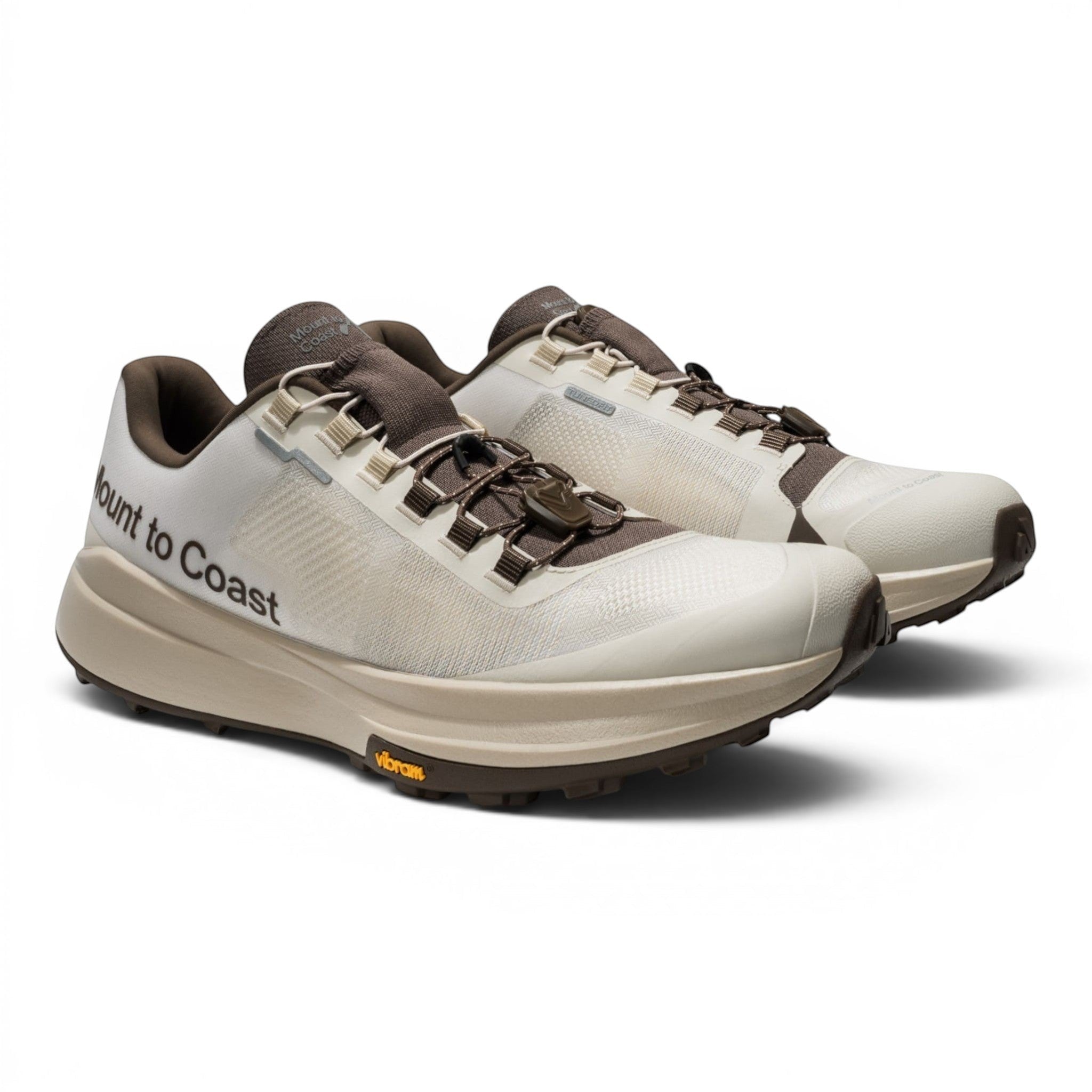 Endurance Edge T1 men's trail running shoes in off-white and brown, featuring a woven upper, dual lacing system, and Vibram outsole.