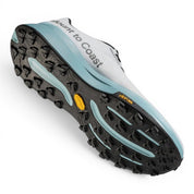 Endurance Edge T1 men's trail running shoes in white with light blue accents and black Vibram sole.