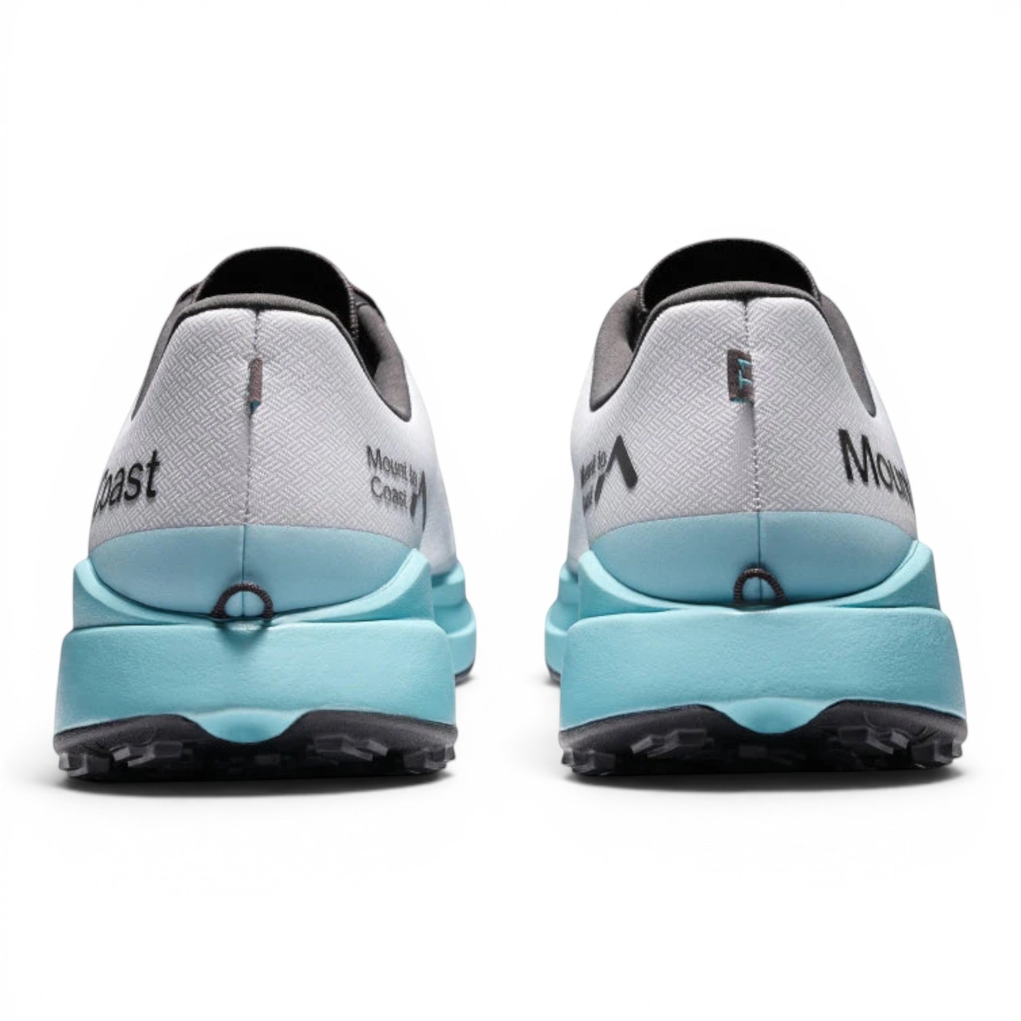 Endurance Edge T1 men's trail running shoes in white with light blue midsoles and black outsoles. Features woven upper.