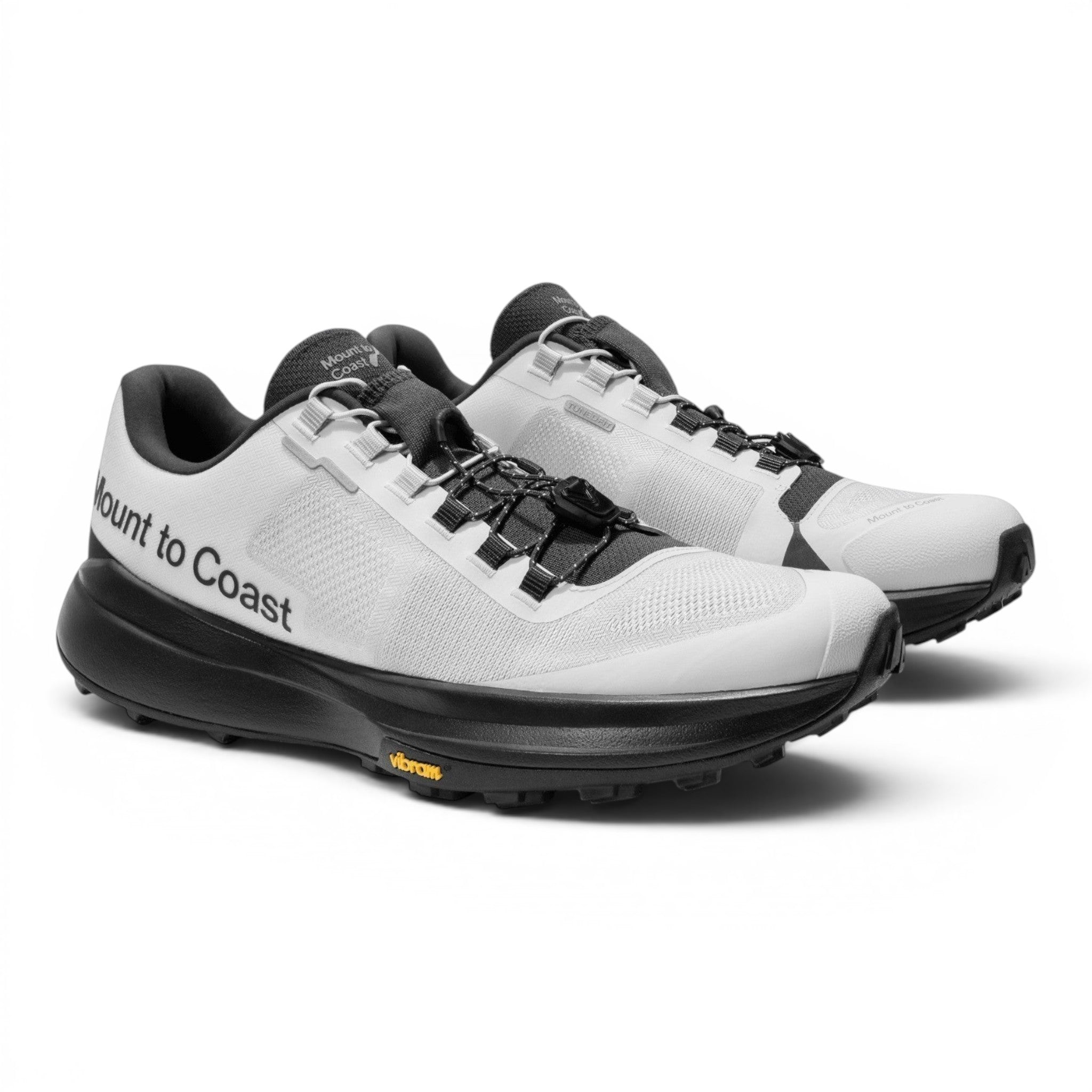 Endurance Edge T1 women's white and black trail running shoes with dual lacing system and Vibram outsole.